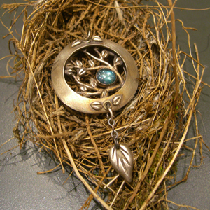 Vickie Hallmark | Tree necklace, open lentil pendant from fine silver with bezel set topaz cabochon